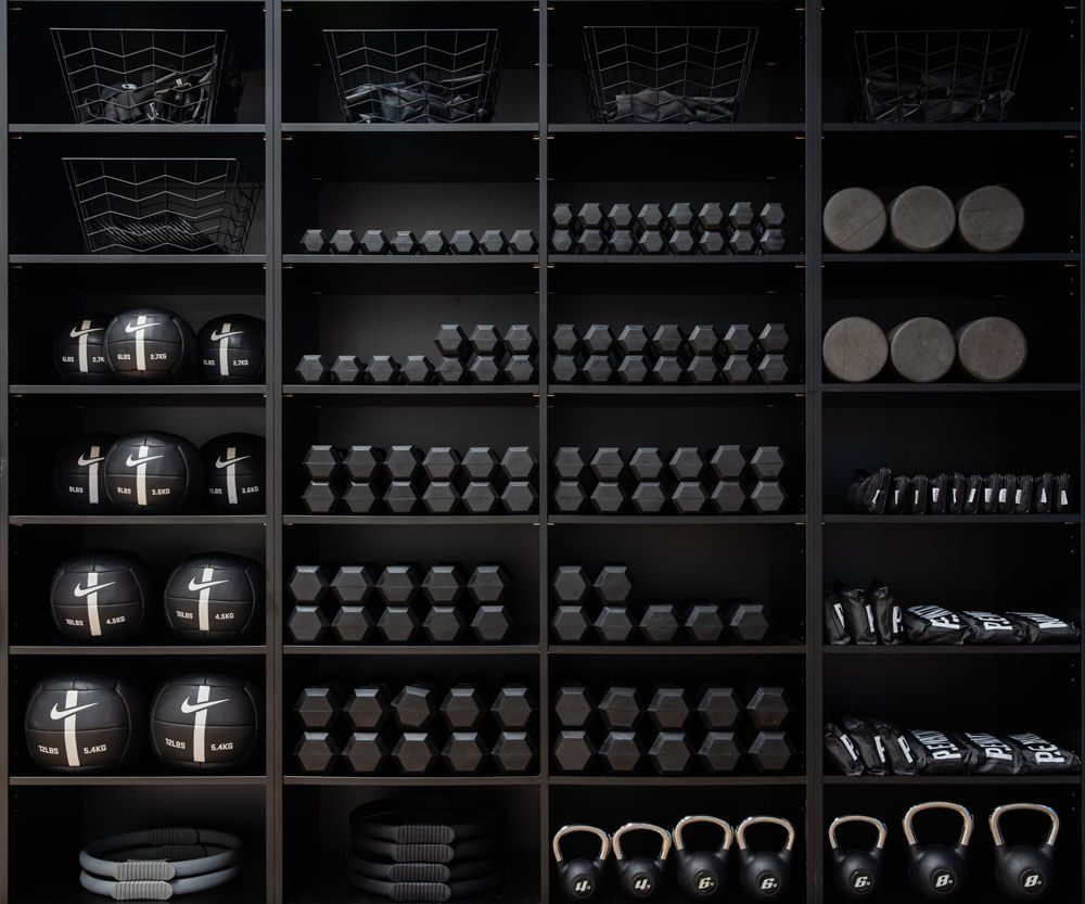 Pilates equipment on black shelving